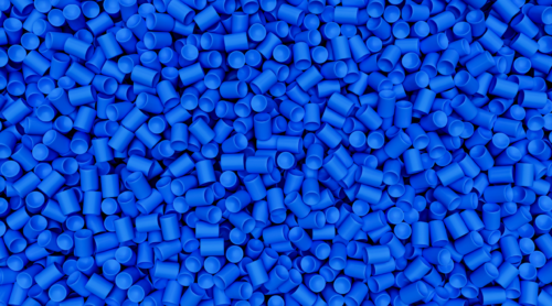 Blue-dyed polymers and elastomers in bulk.