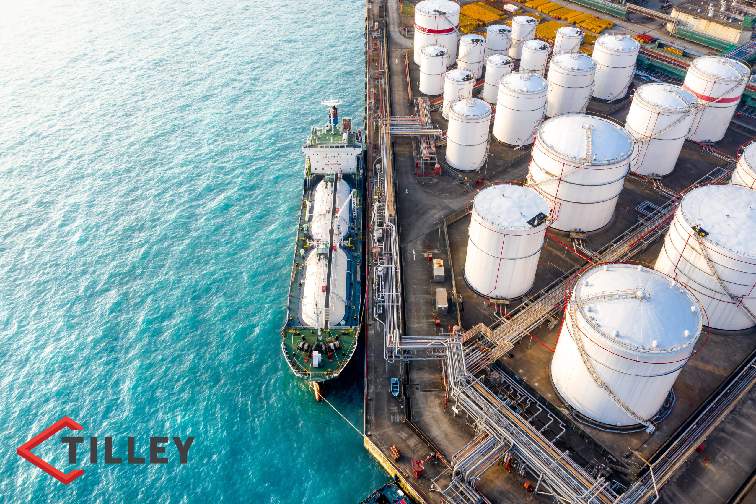 A crude oil tanker floats in the ocean at a refinery.