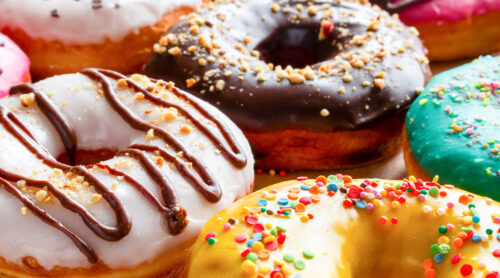 Close-up of delicious frosted donuts.