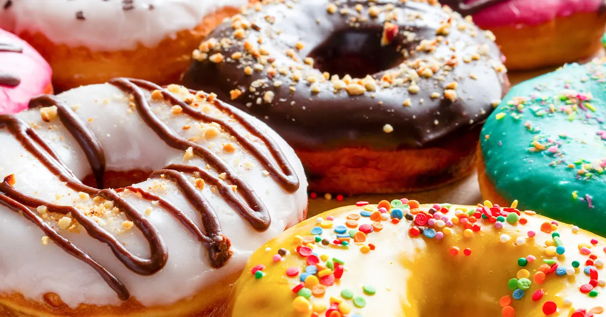 Close-up of delicious frosted donuts.