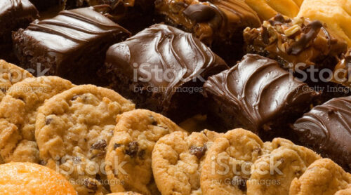 An array of delectable gluten free baked goods on a bakery shelf.